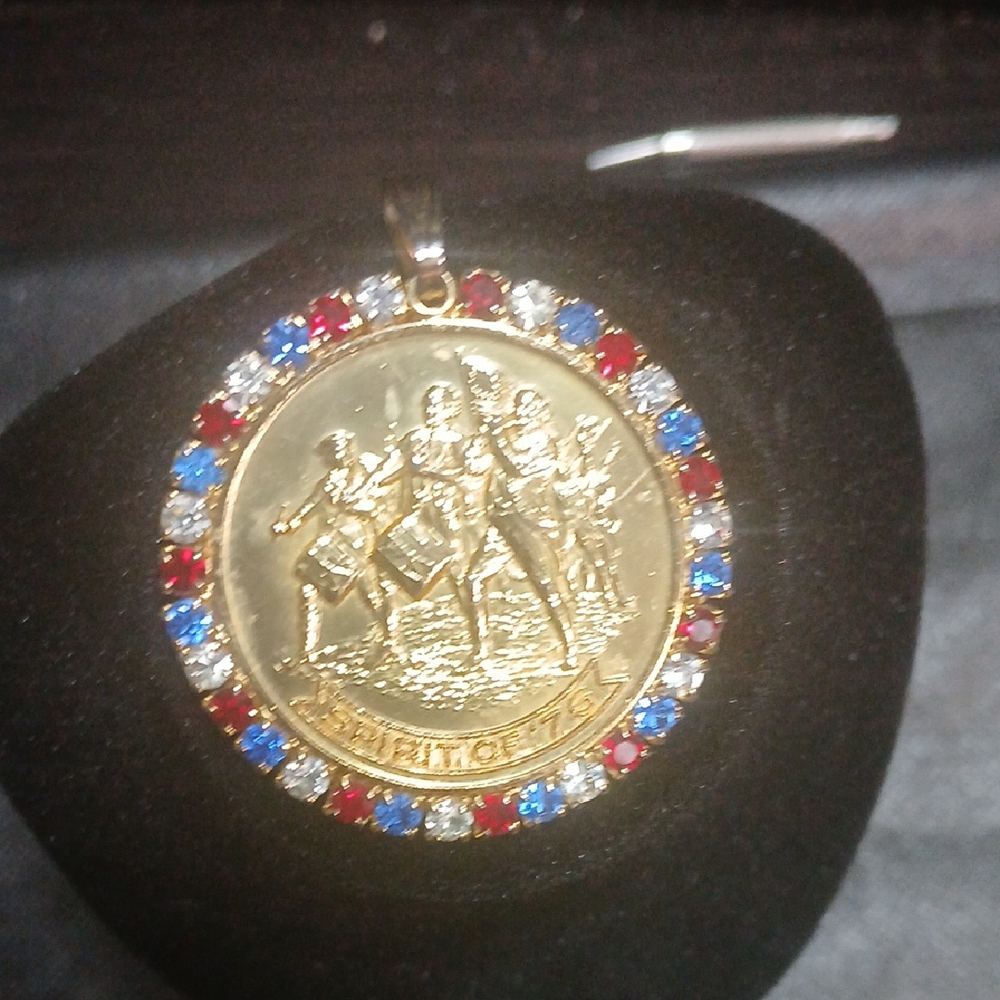 Elegant Gold Medallion Necklace with Red, Blue, and Silver Accents